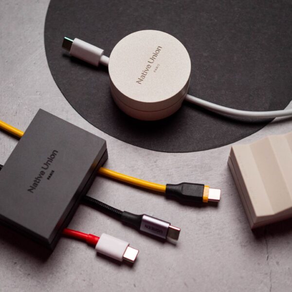 I used a $30 cable weight, and it is now my favorite desk accessory